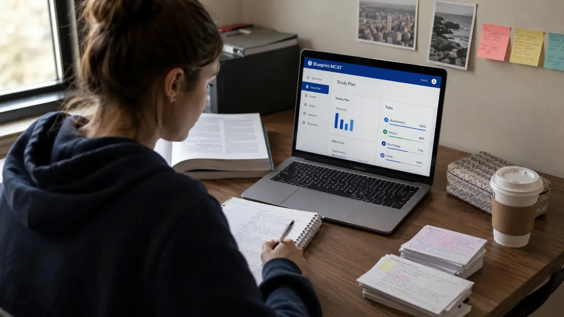 student studying with the blueprint mcat platform open on a laptop at a realistic home study desk