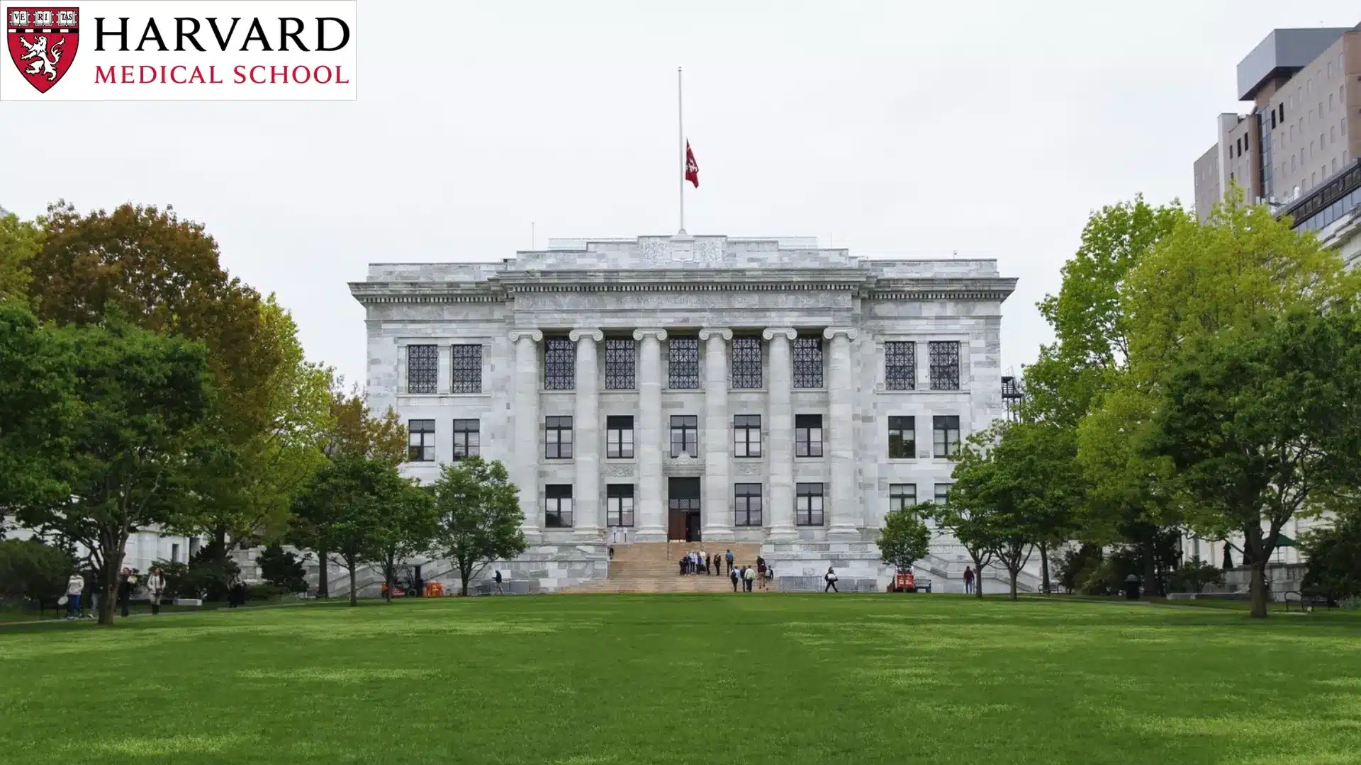 harvard medical school columned building exterior with school crest and signage