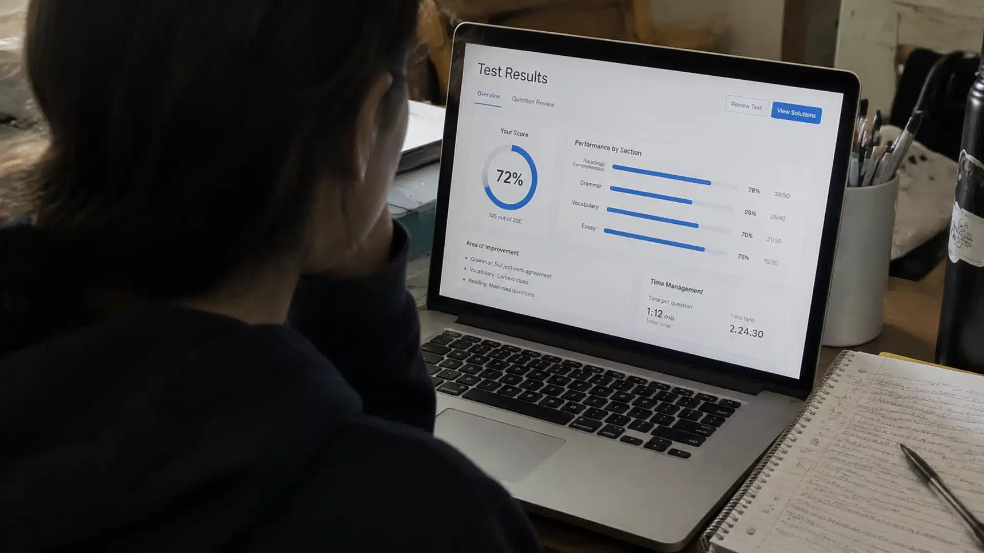 student reviewing sat practice test results and section performance scores on a laptop screen