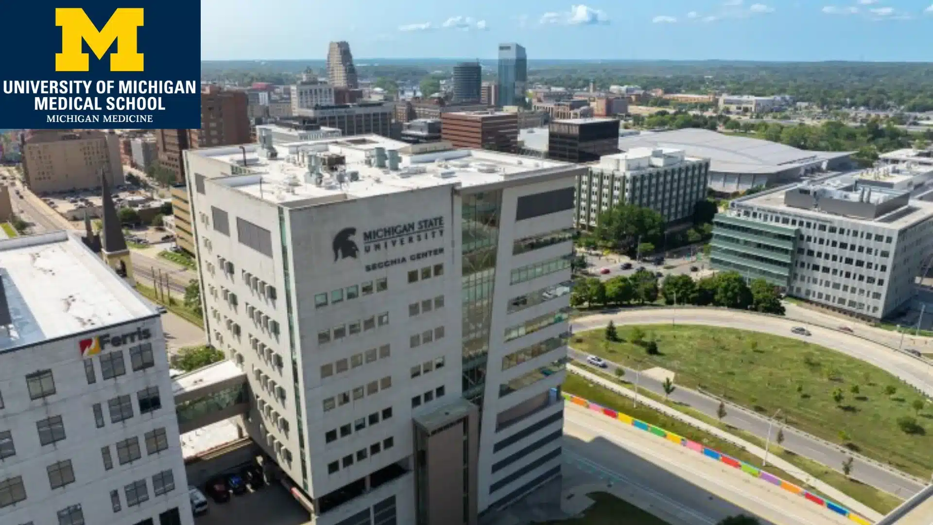 university of michigan medical school campus building with michigan state signage